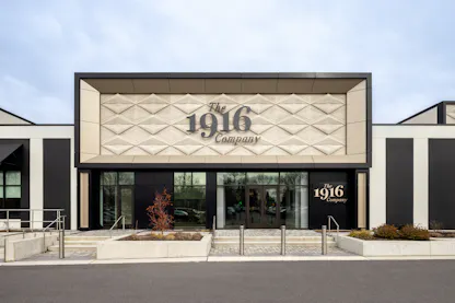The 1916 Company luxury watch boutique exterior storefront with textured facade in Pikesville Baltimore