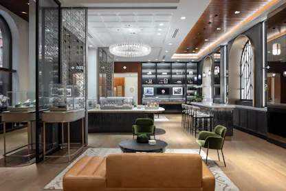 Interior of The 1916 Company luxury watch and jewelry store in Philadelphia, featuring fine watches, exquisite jewelry displays, and a comfortable lounge area on Walnut Street.