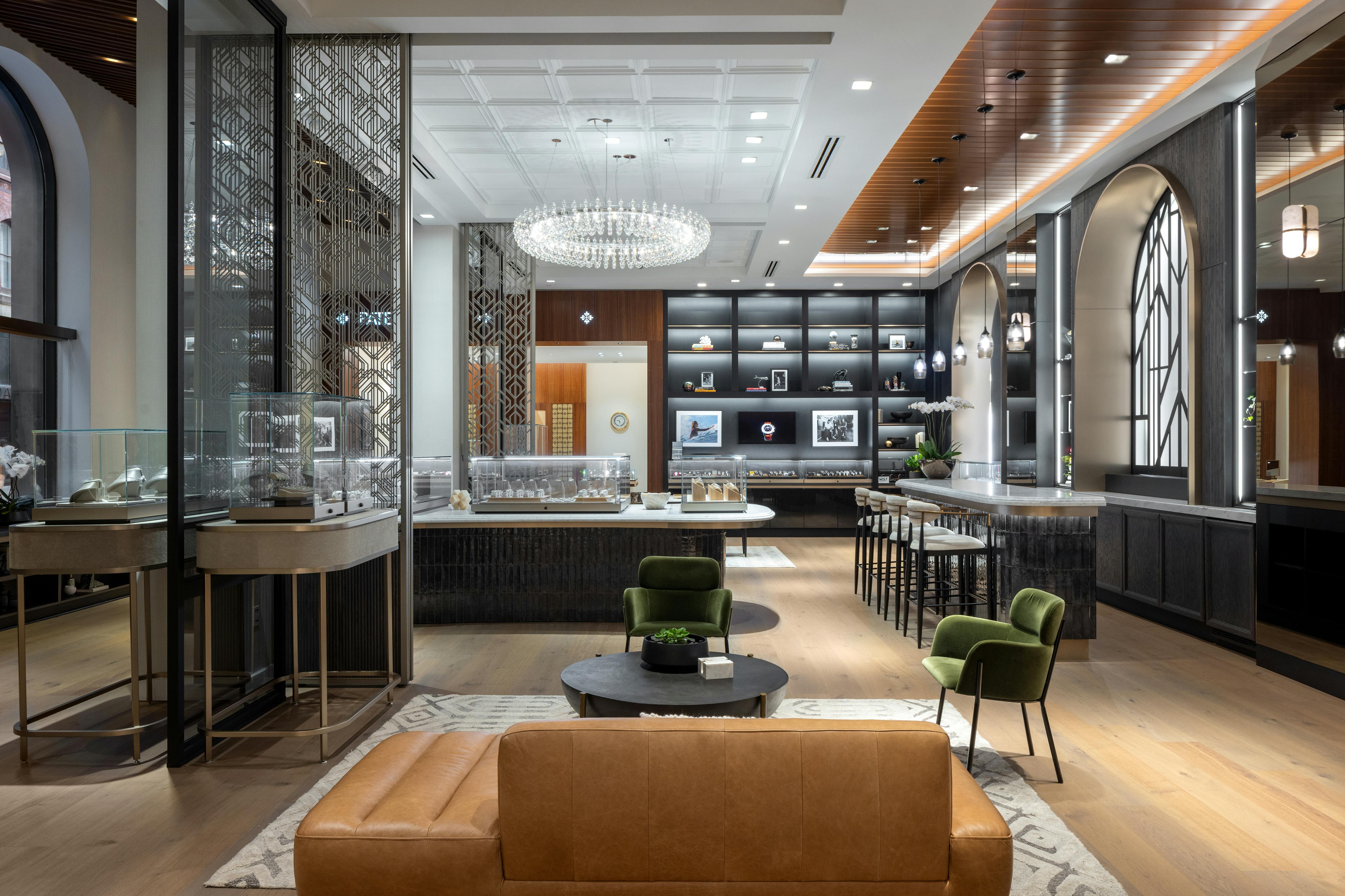 Interior of The 1916 Company luxury watch and jewelry store in Philadelphia, featuring fine watches, exquisite jewelry displays, and a comfortable lounge area on Walnut Street.