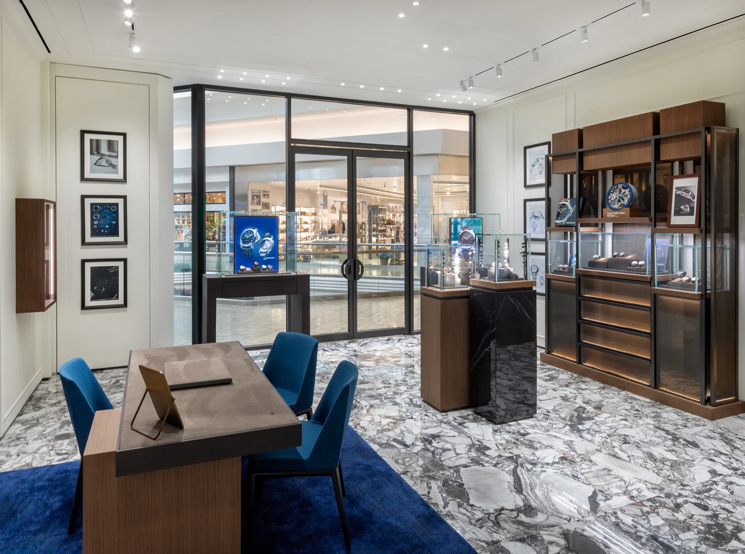 Panerai showroom interior with wood display shelving, watch cases, and Cherry Creek mall entrance view